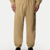 The North Face Долнище анцуг Unisex Mountain Cleanup NF0A8C2W Бежов Relaxed Fit за Унисекс цена