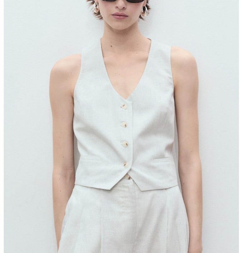 Къс елек с лен и обшити джобове Mango