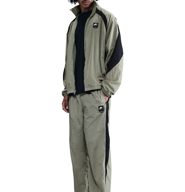 Спортен панталон с джобове с цип и връзки на подгъвите Nike