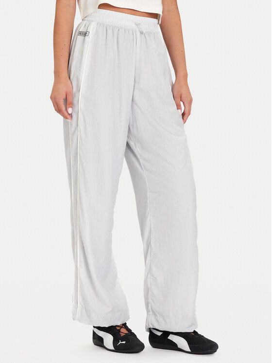 Puma Долнище анцуг PUMA X ROSÉ T7 633796 32 Сребрист Relaxed Fit цвят на ниска цена