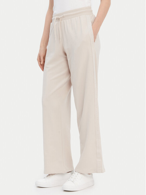 Tommy Hilfiger Долнище анцуг UW0UW04771 Бежов Relaxed Fit цвят на ниска цена