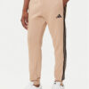 adidas Долнище анцуг Essentials 3-Stripes JX0712 Бежов Regular Fit цвят на ниска цена