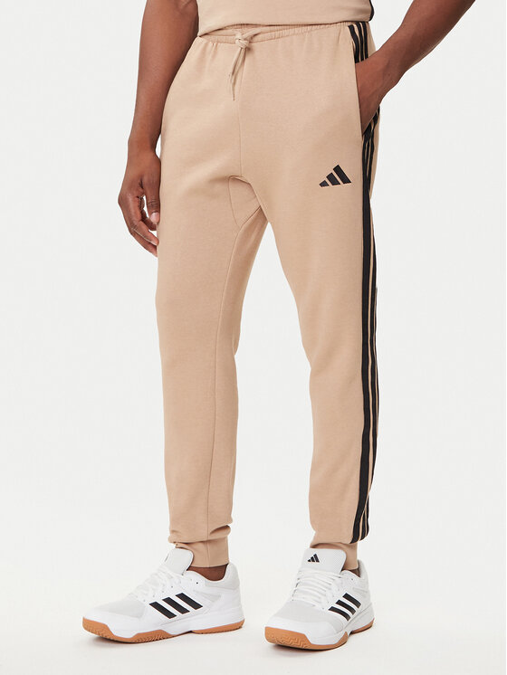 adidas Долнище анцуг Essentials 3-Stripes JX0712 Бежов Regular Fit цвят на ниска цена