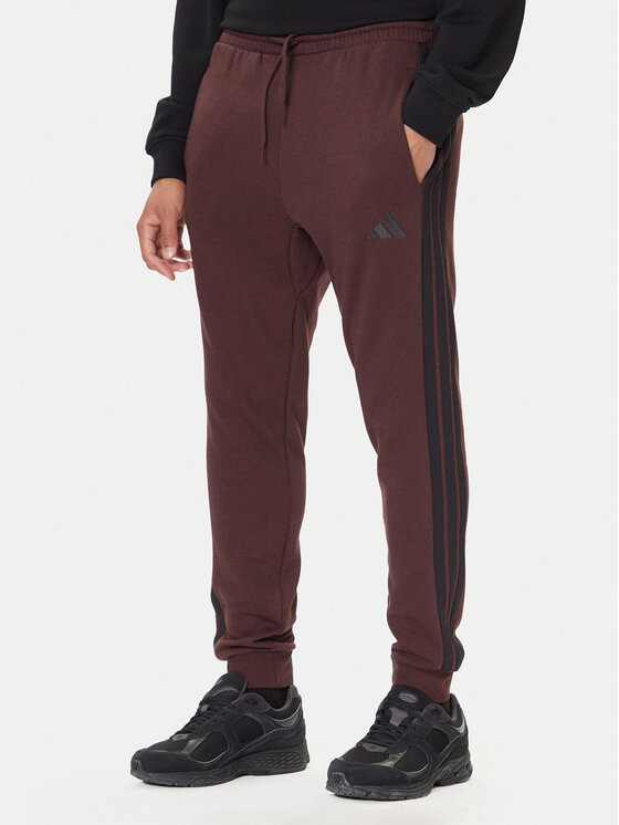 adidas Долнище анцуг Essentials 3-Stripes JX0749 Кафяв Regular Fit цвят на ниска цена