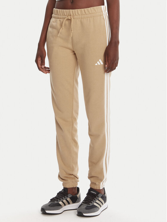 adidas Долнище анцуг Essentials 3-Stripes JX7661 Бежов Regular Fit цвят на ниска цена