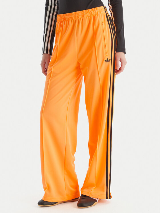 adidas Долнище анцуг adicolor Classic Firebird JY2694 Жълт Loose Fit цвят на ниска цена