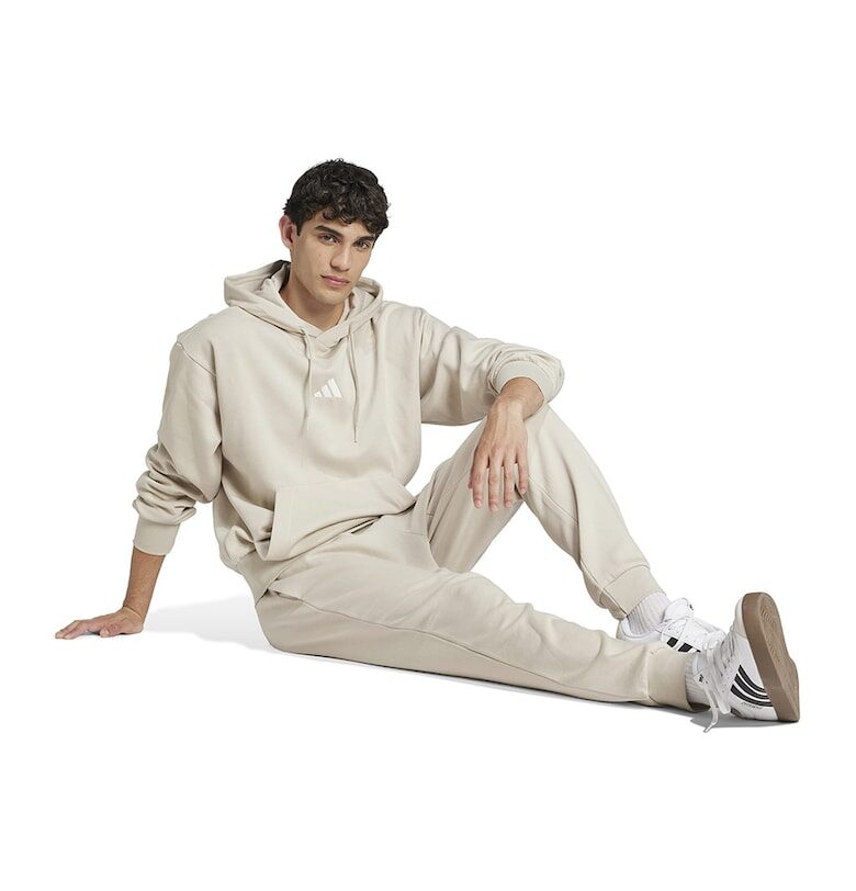 Скосен спортен панталон FeelCozy с връзка adidas Sportswear